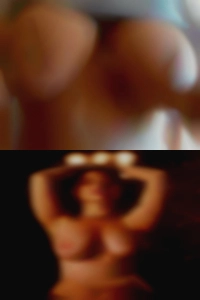 Nude woman holding local nude penis.